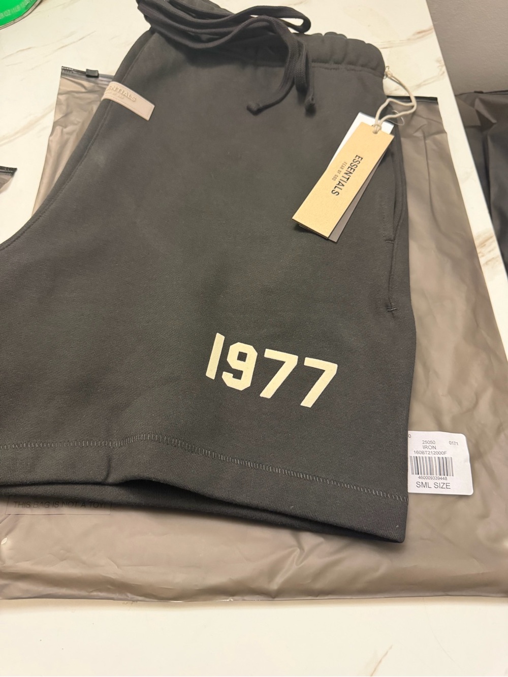 Essentials Men’s Charcoal Sweat Shorts with Cream '1977' Print